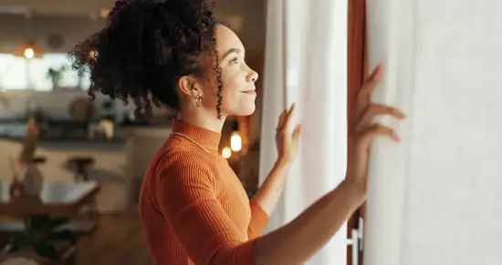 Woman happy looking out of window